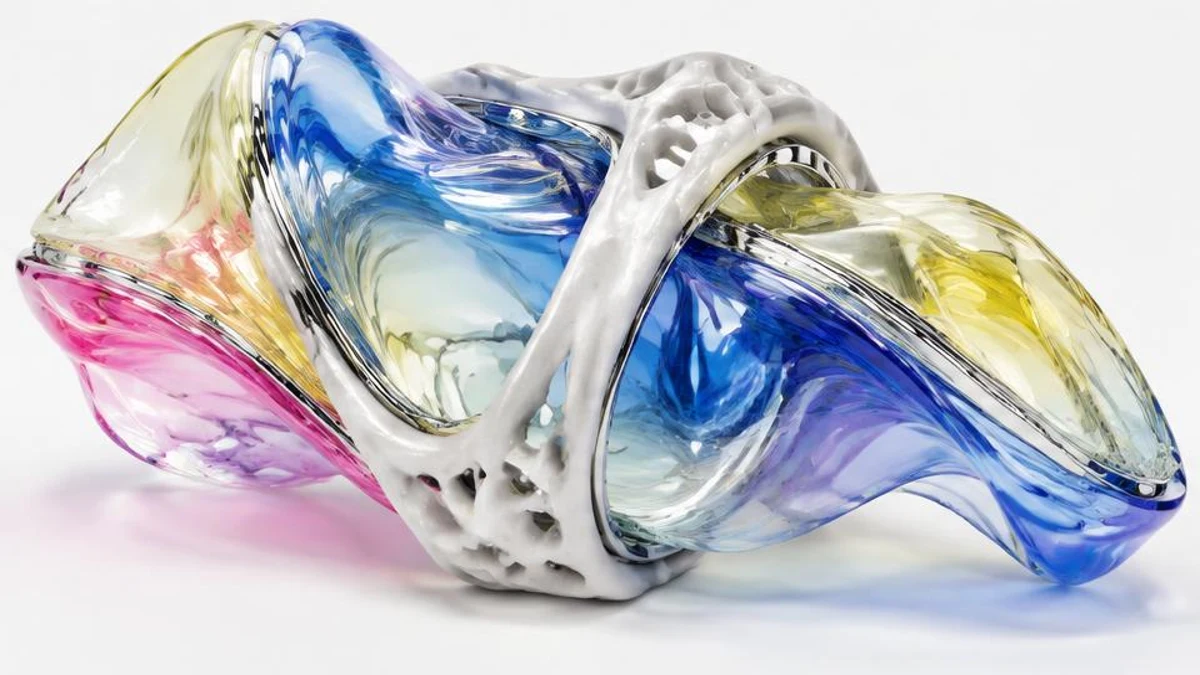 Abstract glass and chrome sculpture representing What does this have to do with AI-assisted website development